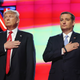 Republican presidential candidates Donald Trump and Sen. Ted Cruz (R-TX), listen to the national anthem before the start of the CNN, Salem Media Group, The Washington Times Republican Presidential Primary Debate on the campus of the University of Miami on March 10, 2016 in Coral Gables, Florida.